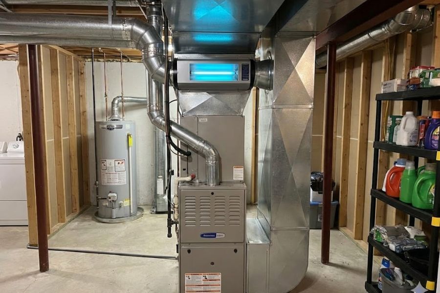 technician installing duct mounted uv purifier