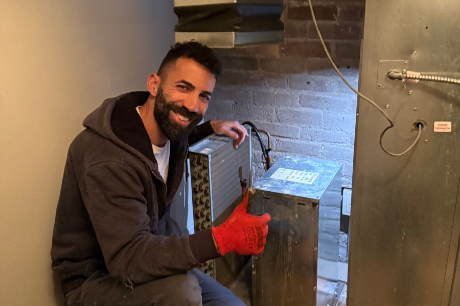 man providing AC repair services for AC short cycling