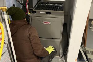 hvac technician testing furnace temperature rise