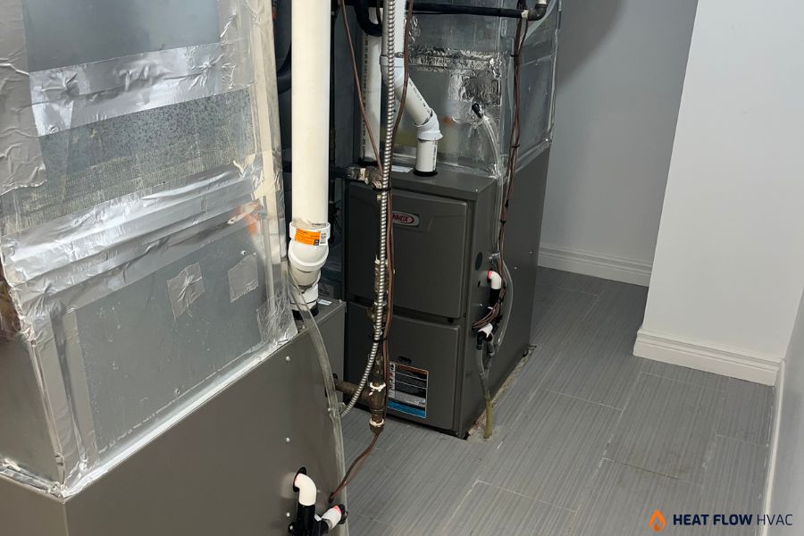 technician troubleshooting furnace burning smell