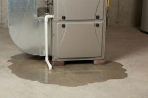 furnace leaking water on basement floor puddle