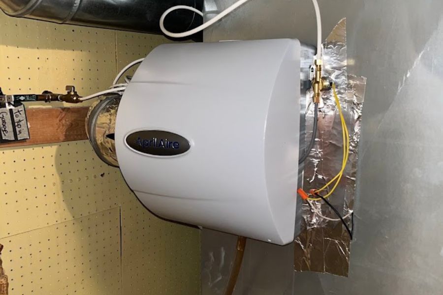 technician repairing whole house humidifier